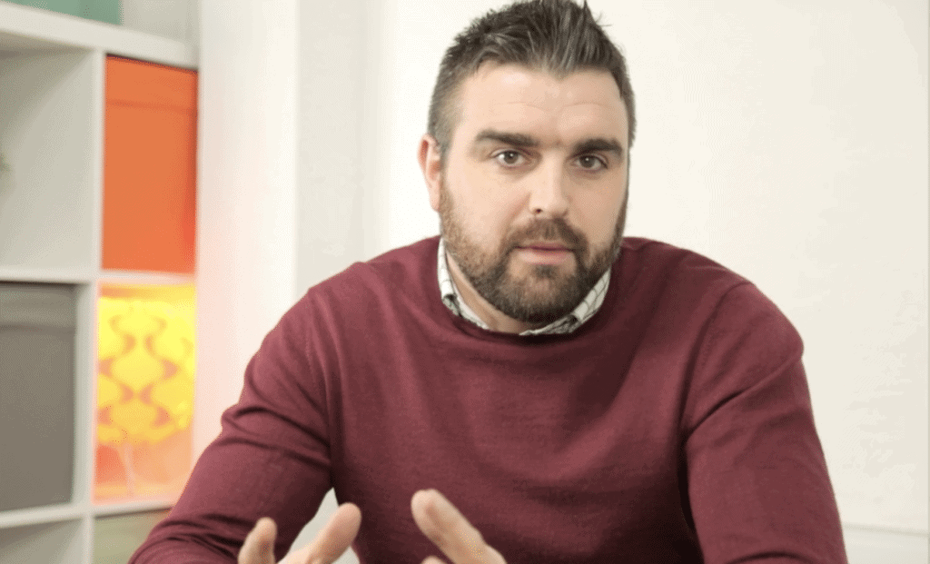 Jovan delivering a video blog to camera