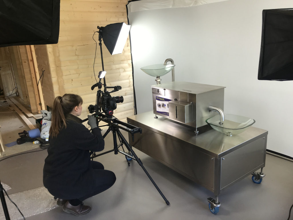 Product shoot in a cabin with white backdrop and grey Lino with Amy shooting close ups of the unit