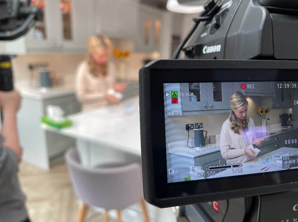 Shot of the camera viewfinder with a product demonstration taking place