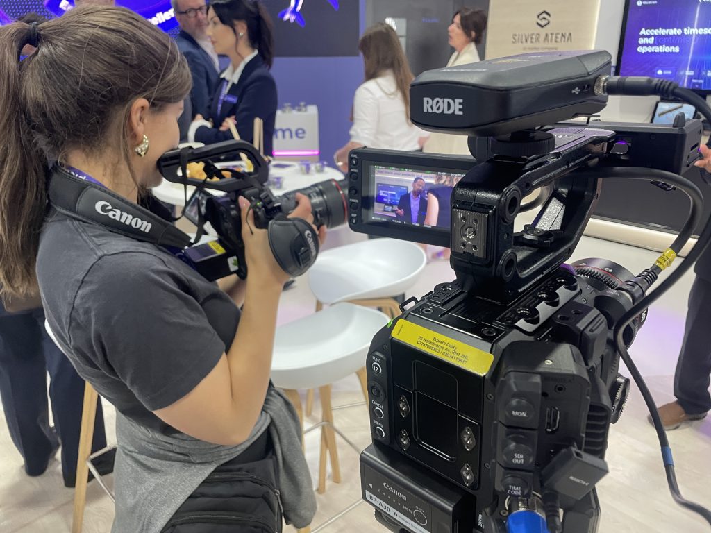 Woman videographer holding a camera