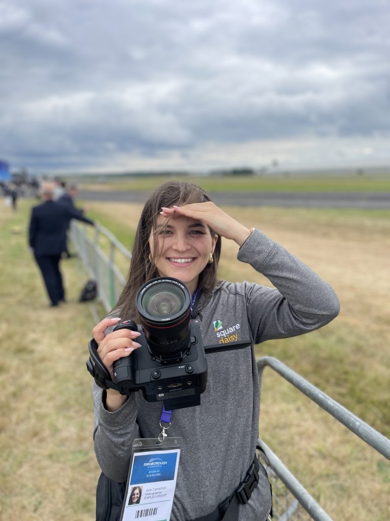 woman videographer holding a camera