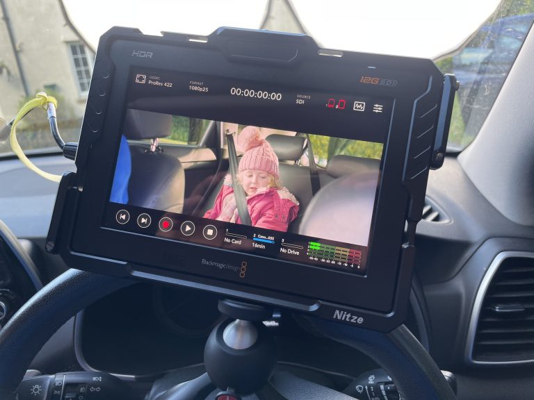 Directors monitor mounted within a car for a car scene
