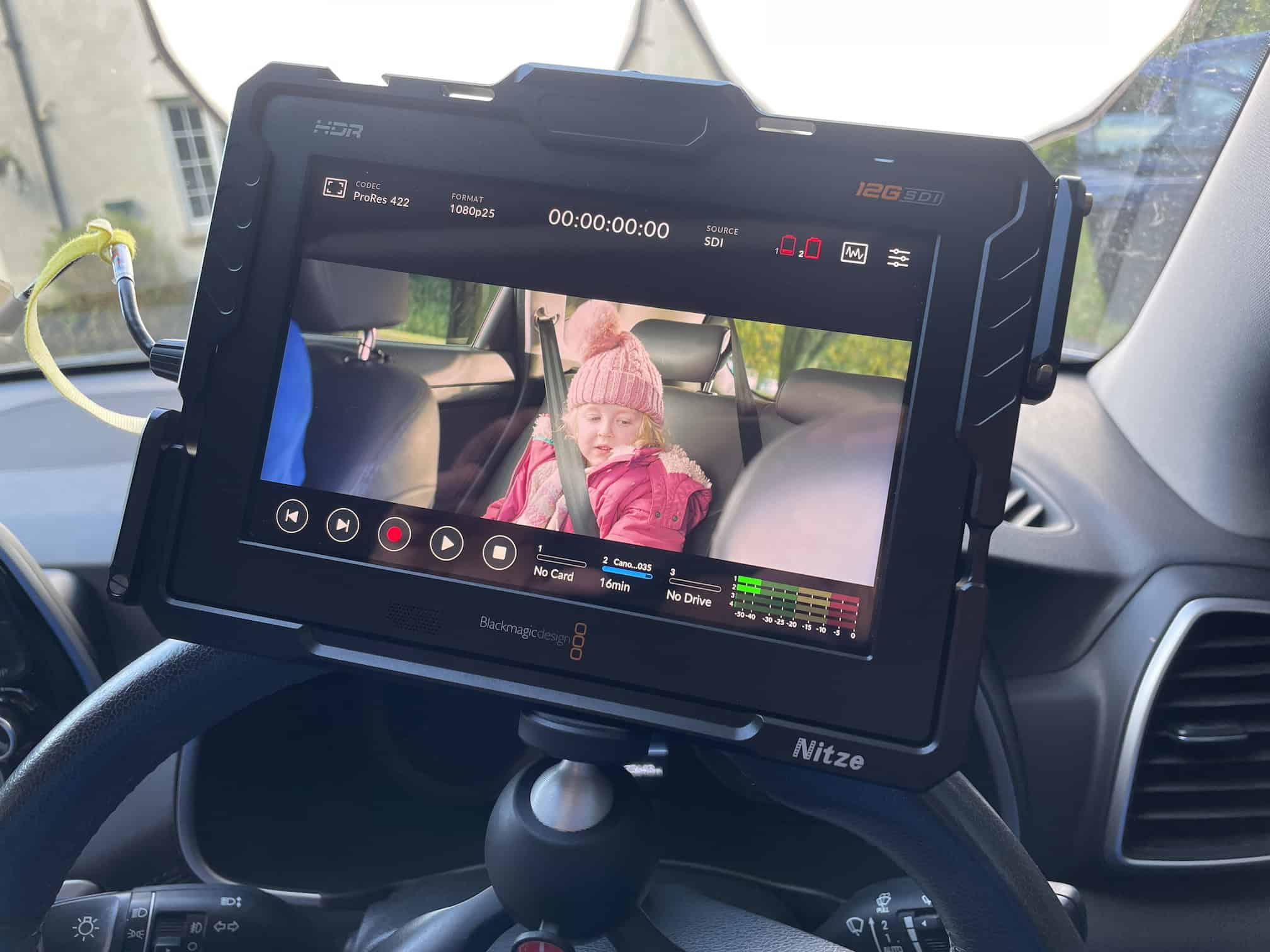 Directors monitor mounted within a car for a car scene
