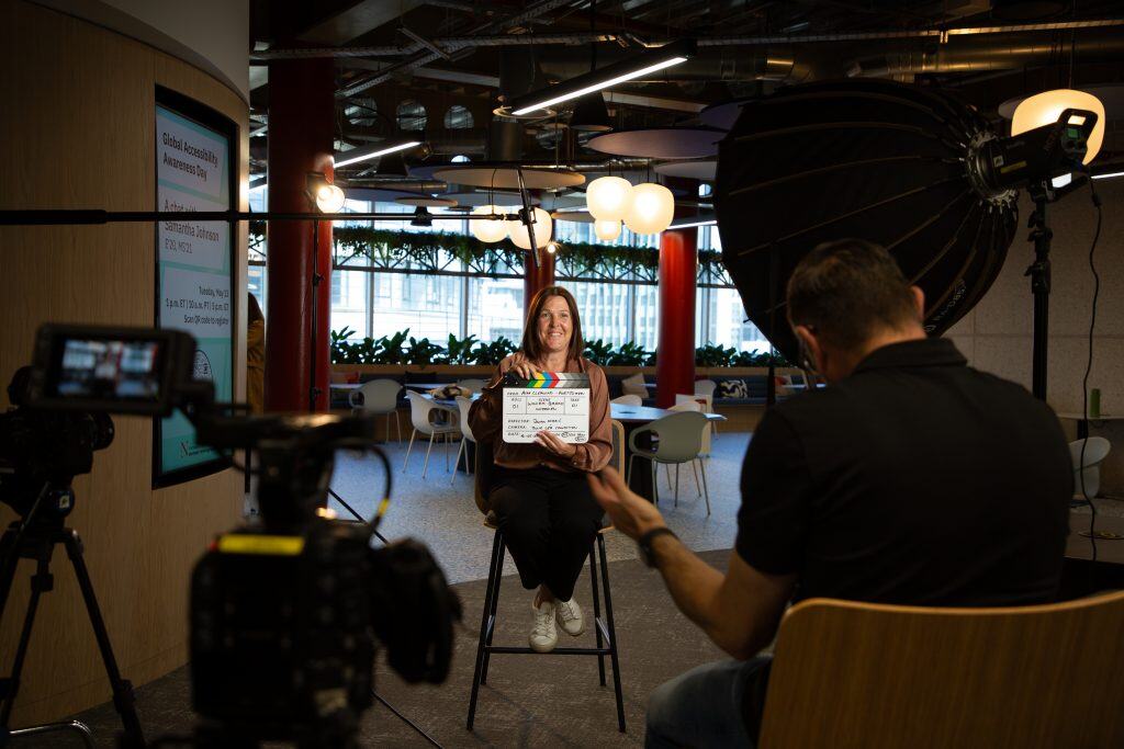 Nicola Smith holding a clapperboard before her interview