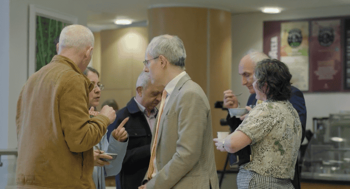 People talking and networking at a conference