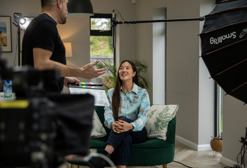 Behind the scenes shot with actor and clapperboard