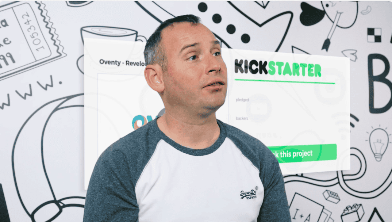 Client delivering to camera with a graphic of a kickstarter campaign screen behind them