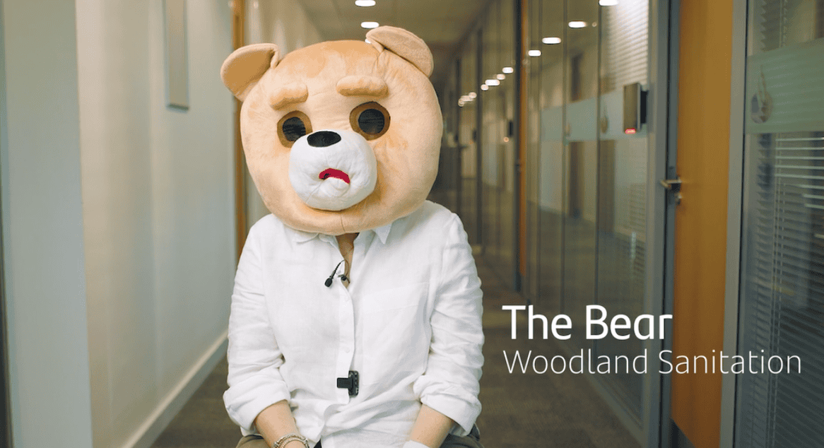 Actor wearing a bear head for a funny corporate video